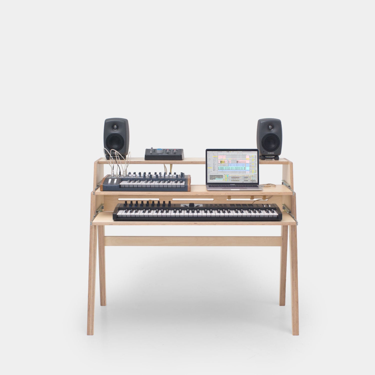 Small studio desk with dual keyboard trays inspired by Mid Century style –  audiohousing